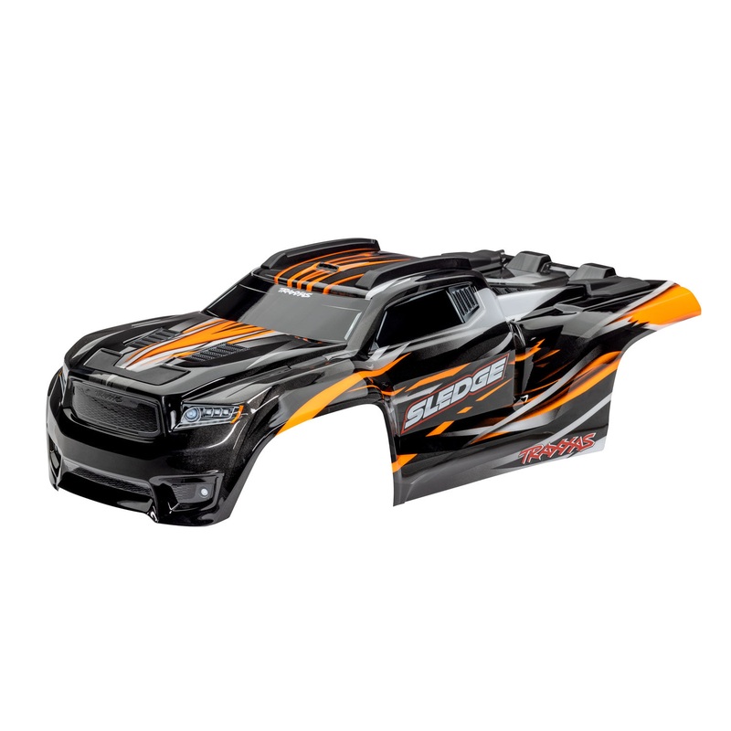 TRAXXAS 9511T Body, Sledge, orange/ window, grille, lights decal sheet (assembled with front & rear body mounts and rear body support for clipless mounting)