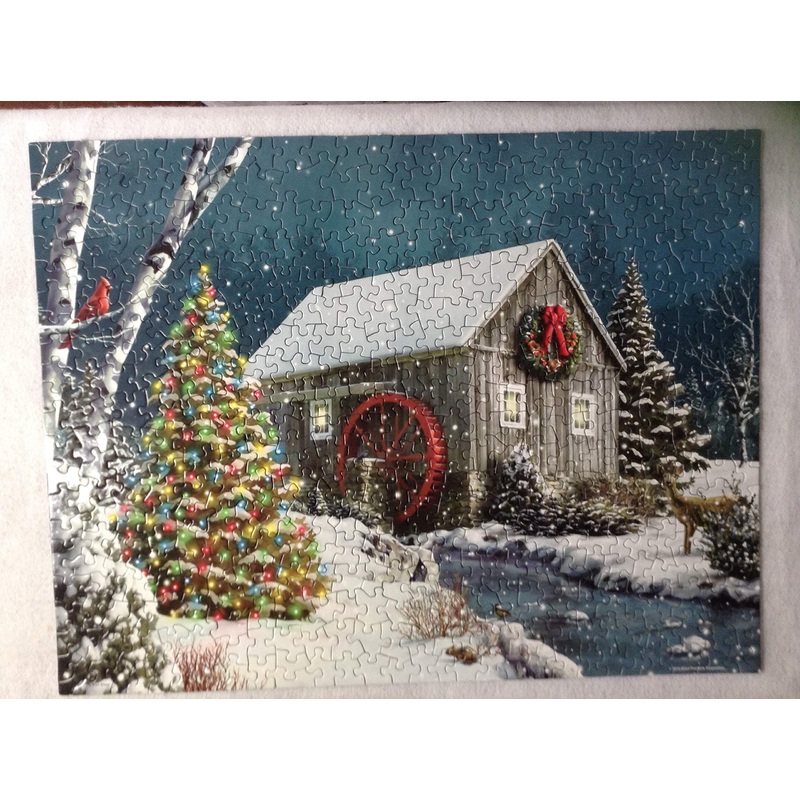 Springbok The Falling Snow 500 Piece Jigsaw Puzzle For Adults Features A Holiday Cabin Glowing In The Snow With A Decorated Christmas Tree Beside It